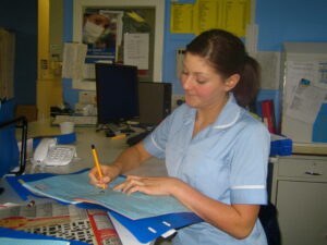 Staff_Nurse_Andrea_writing_up_her_notes